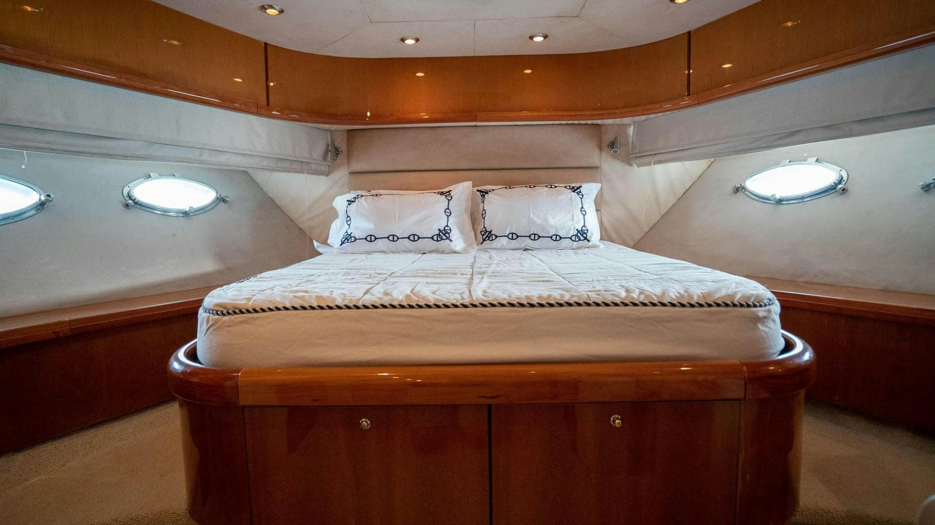 a bed with a sink and a mirror above it aboard LUCKY Yacht for Sale