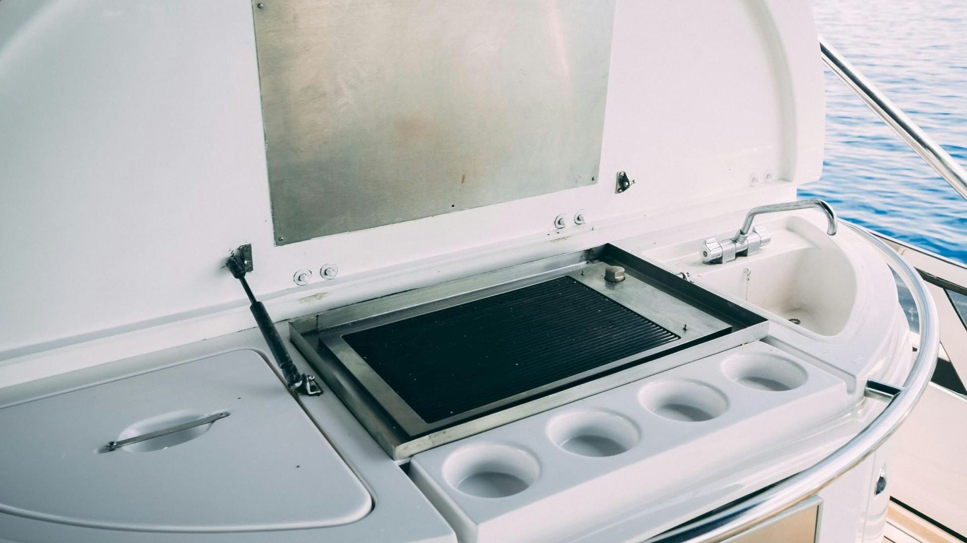 a white washing machine aboard LUCKY Yacht for Sale