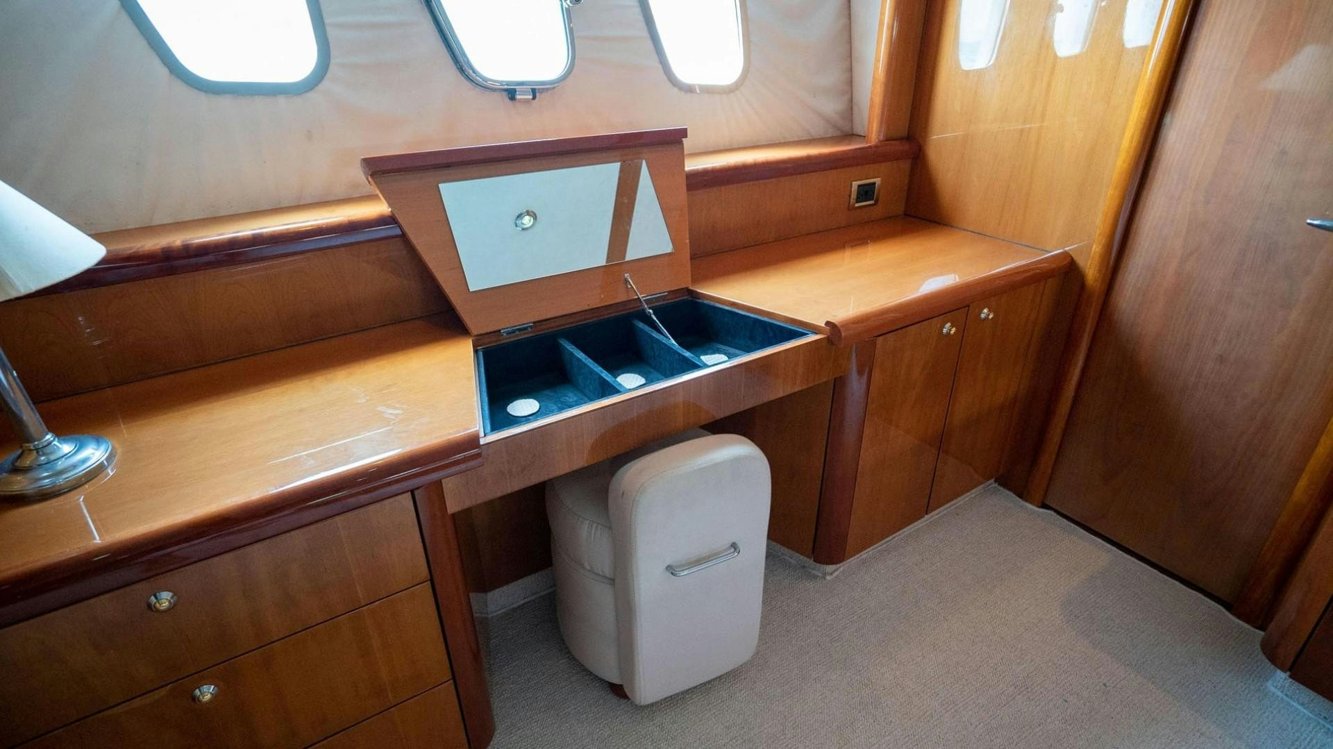 a small kitchen with a sink and microwave aboard LUCKY Yacht for Sale