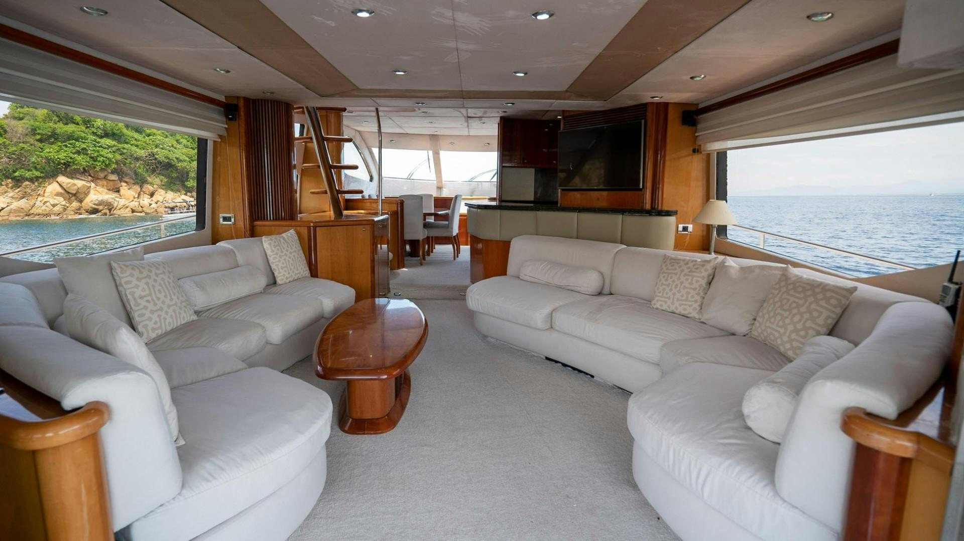 a living room with a large window aboard LUCKY Yacht for Sale