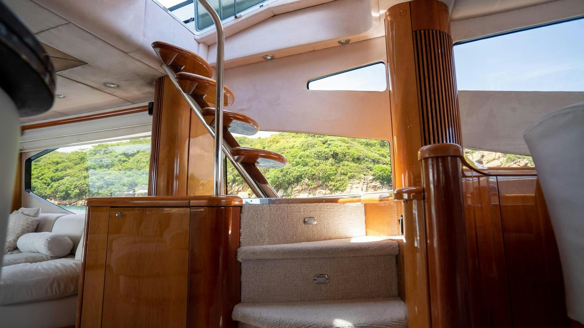 a wooden chair on a porch aboard LUCKY Yacht for Sale