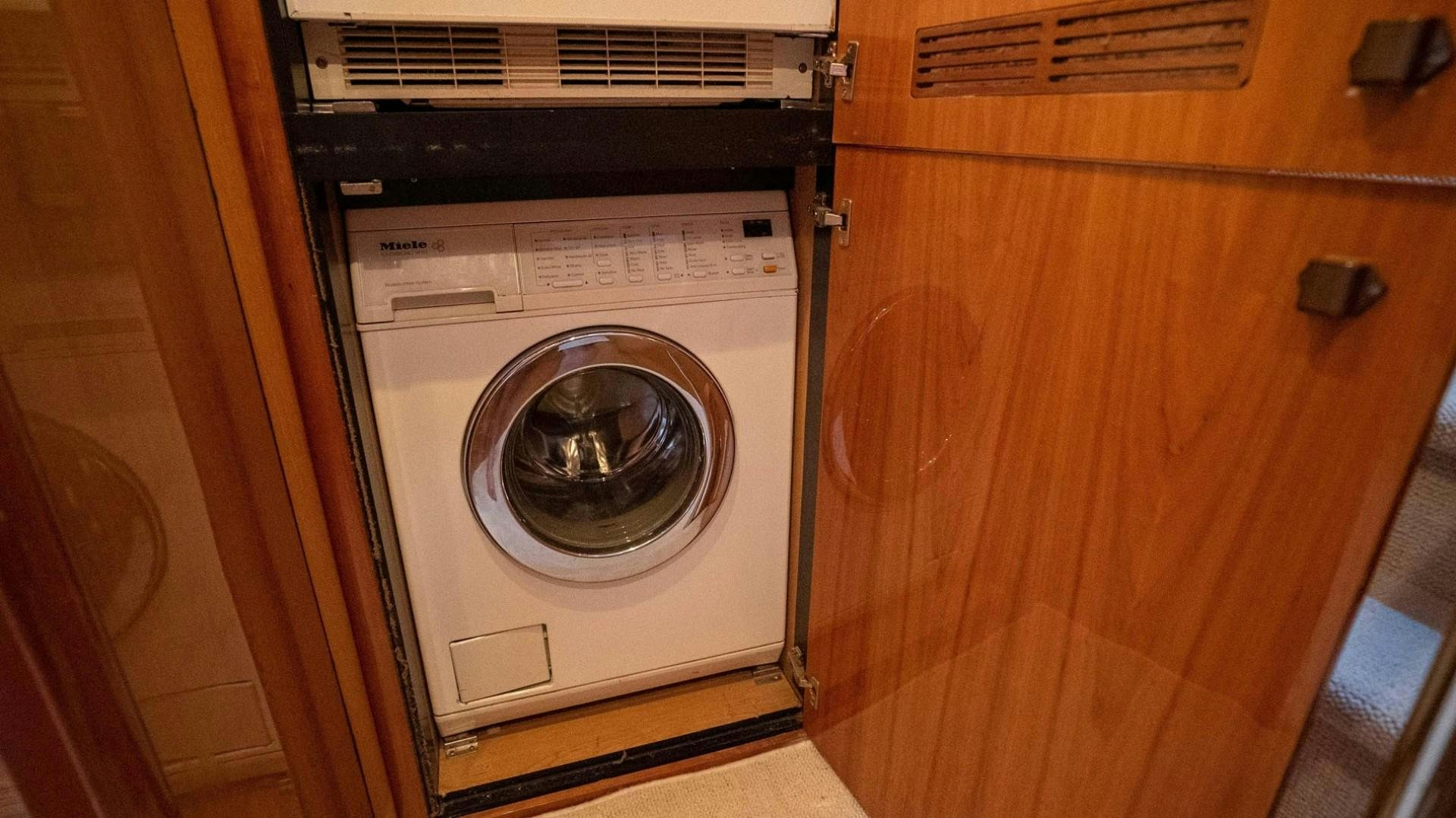a washing machine in a room aboard LUCKY Yacht for Sale