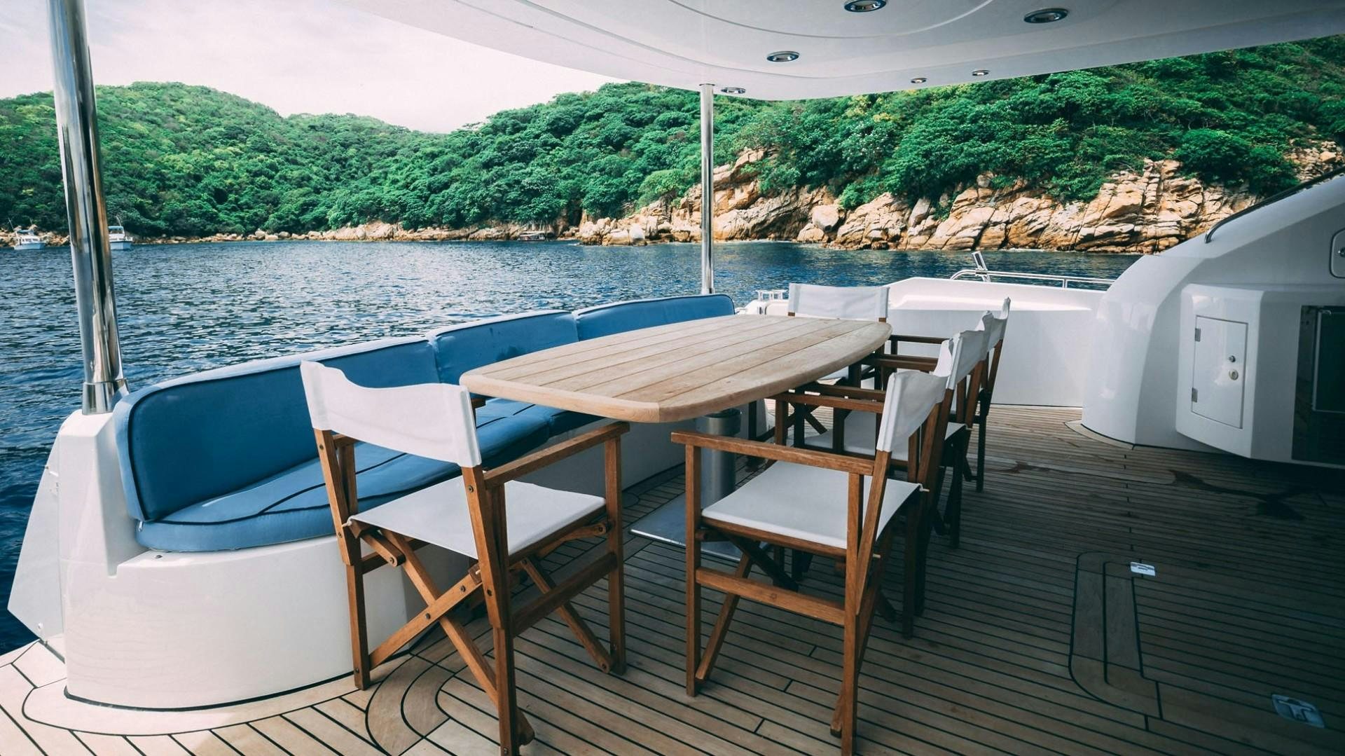 a table and chairs on a boat aboard LUCKY Yacht for Sale