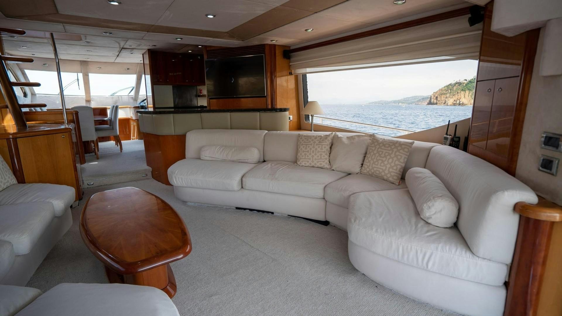 a living room with a couch and a television aboard LUCKY Yacht for Sale