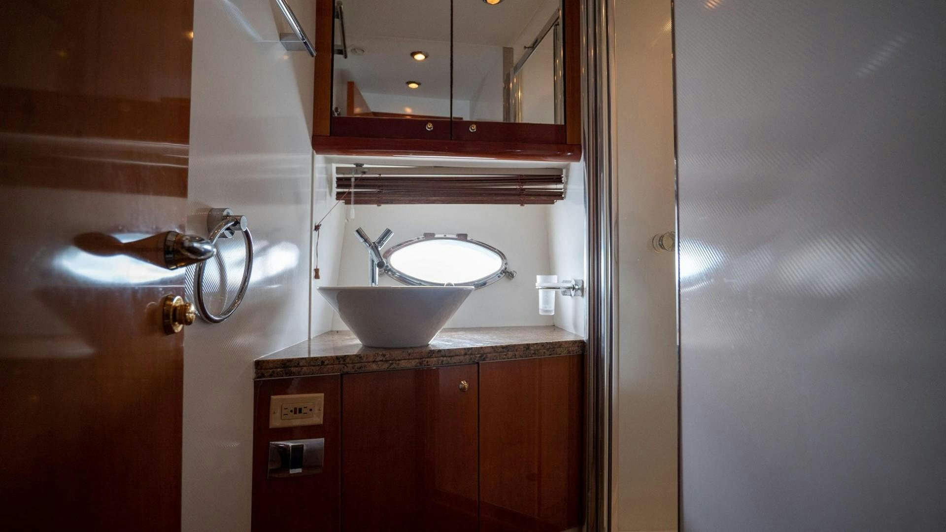 a sink and a mirror in a bathroom aboard LUCKY Yacht for Sale