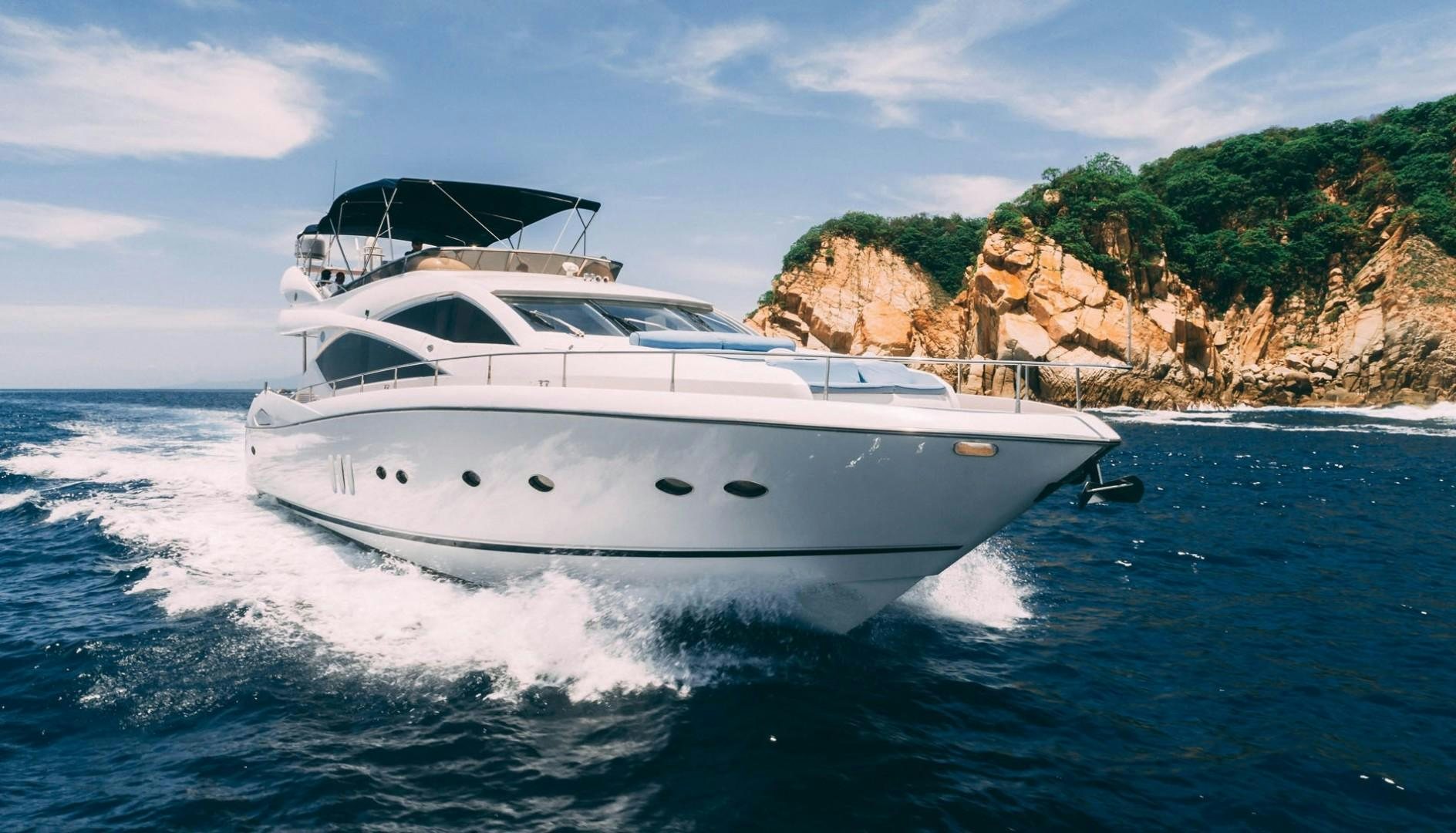 a white yacht on the water aboard LUCKY Yacht for Sale