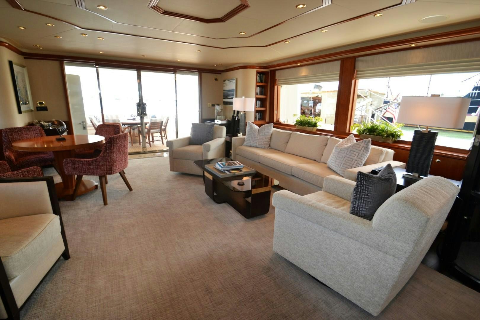 a living room with a couch and a table aboard REBELLIOUS Yacht for Sale