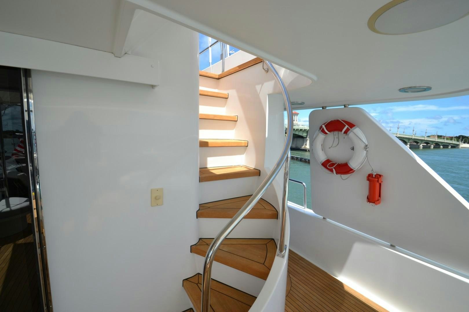 a white and red staircase on a boat aboard REBELLIOUS Yacht for Sale