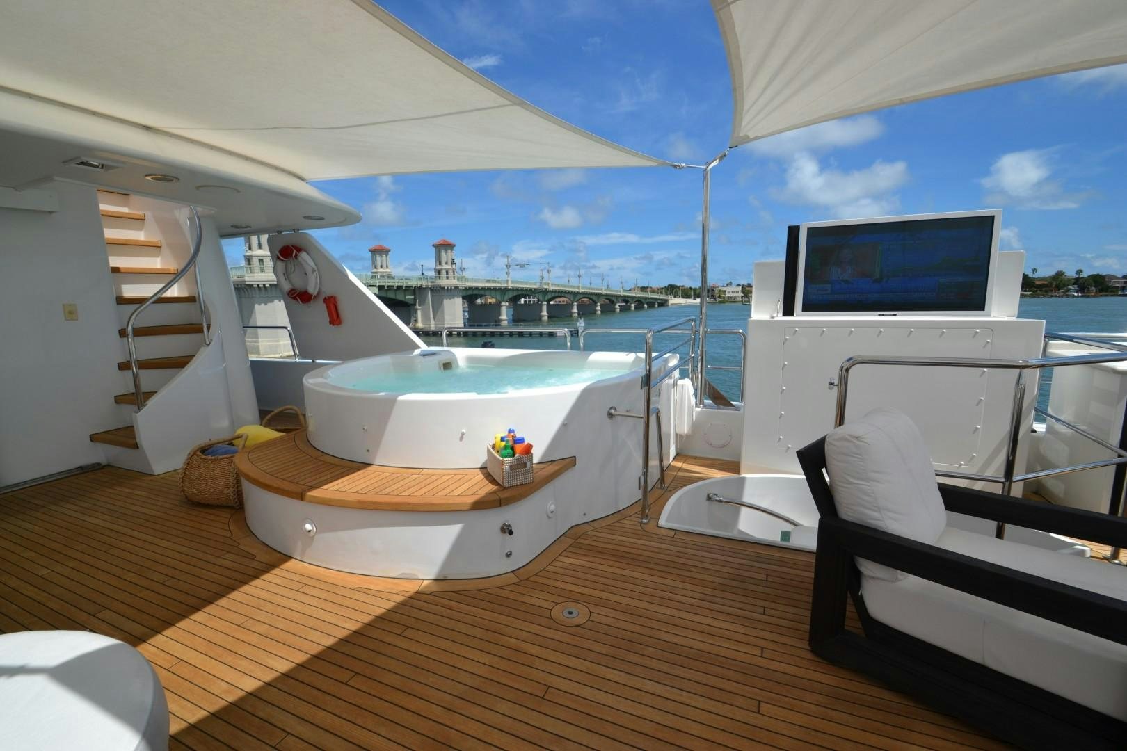 a room with a bed and a laptop on the bed aboard REBELLIOUS Yacht for Sale