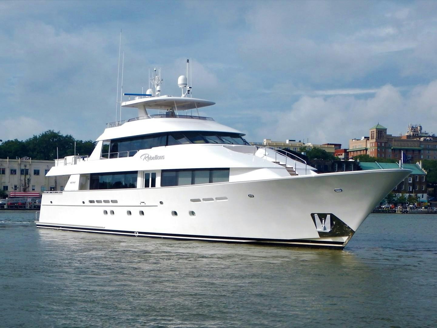 a white boat in the water aboard REBELLIOUS Yacht for Sale