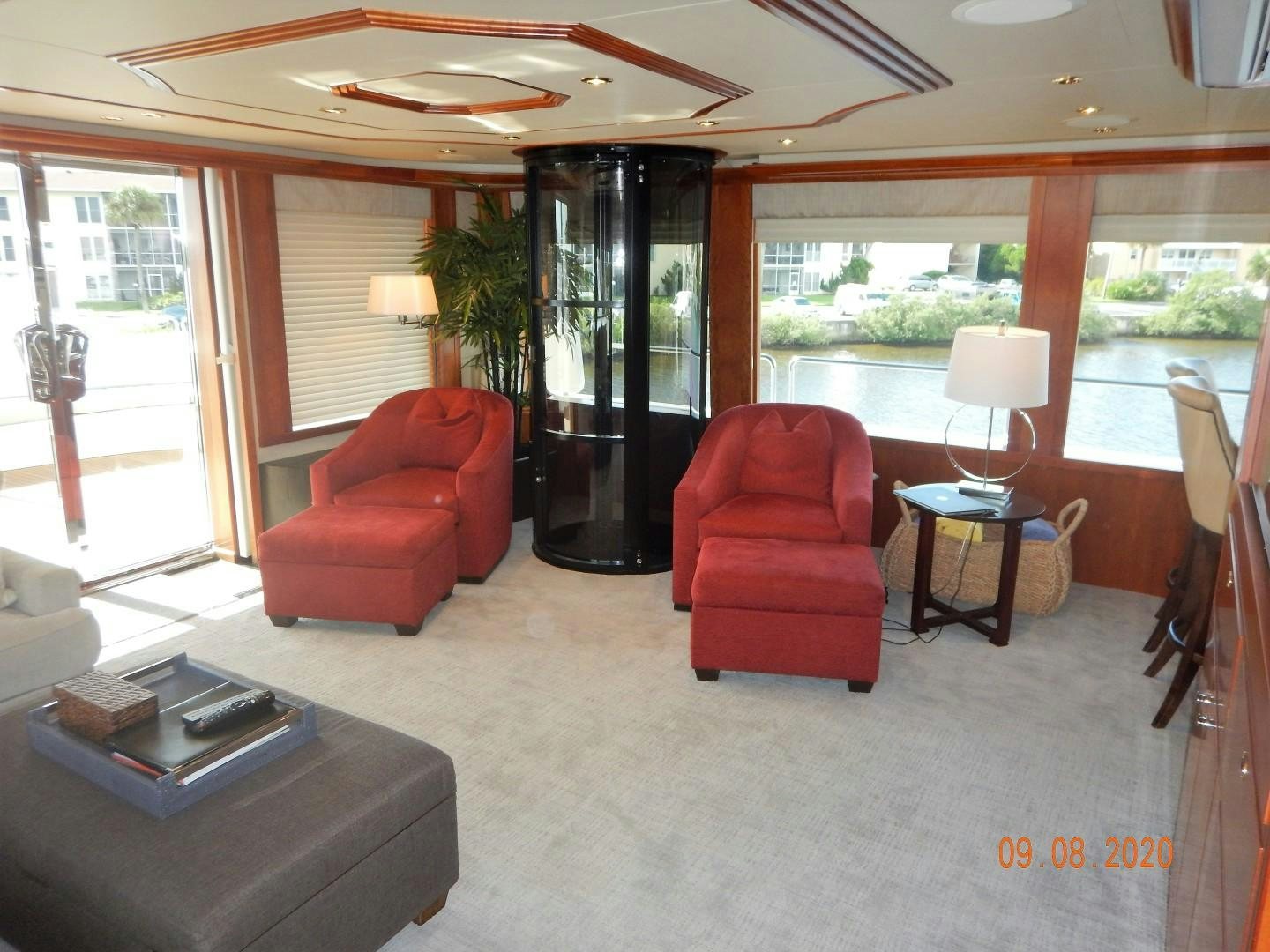 a living room with a large window aboard REBELLIOUS Yacht for Sale