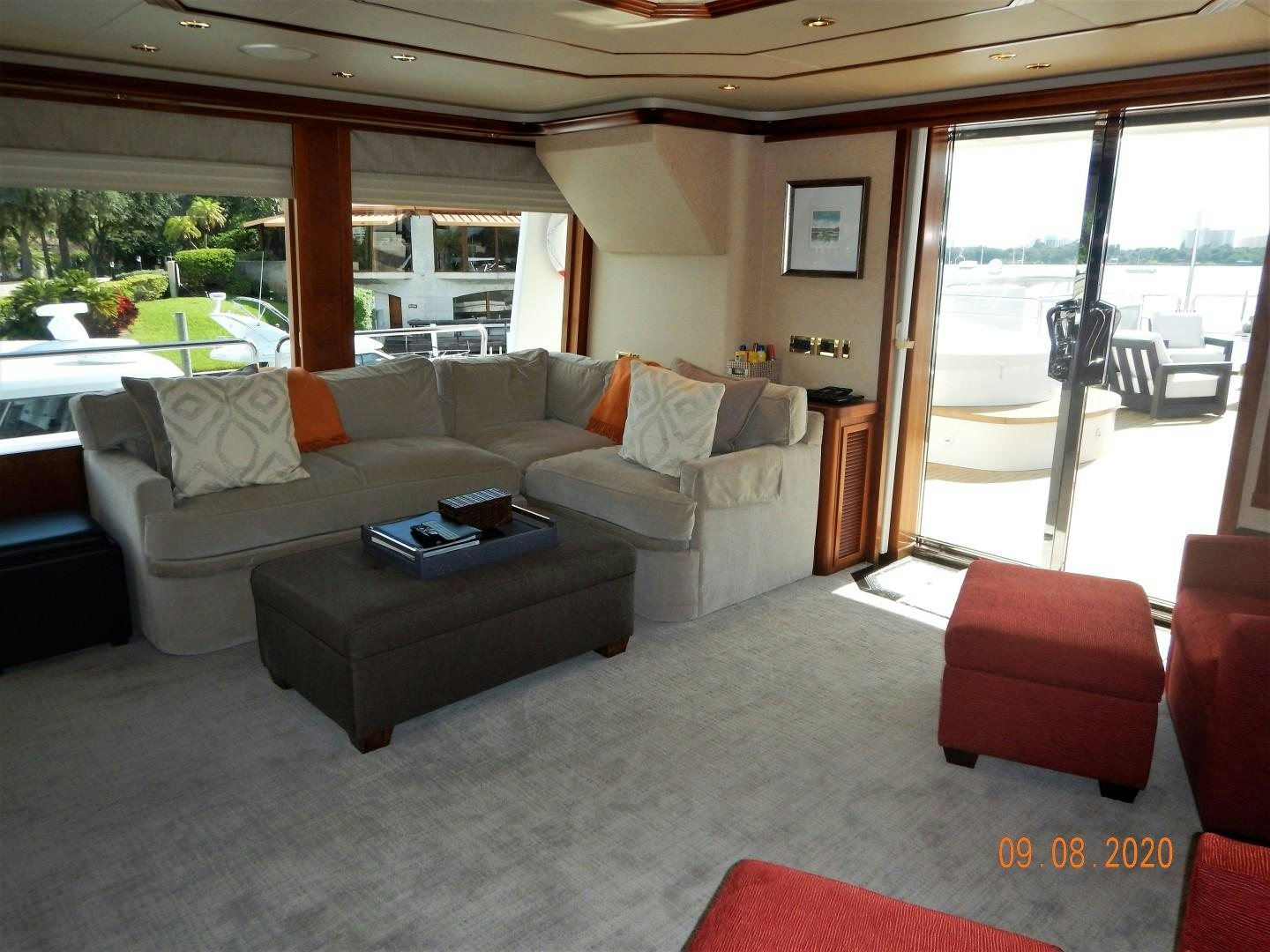 a living room with a couch and a table aboard REBELLIOUS Yacht for Sale