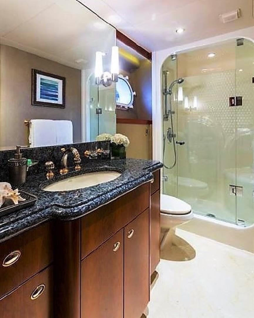 a bathroom with a marble counter top aboard REBELLIOUS Yacht for Sale