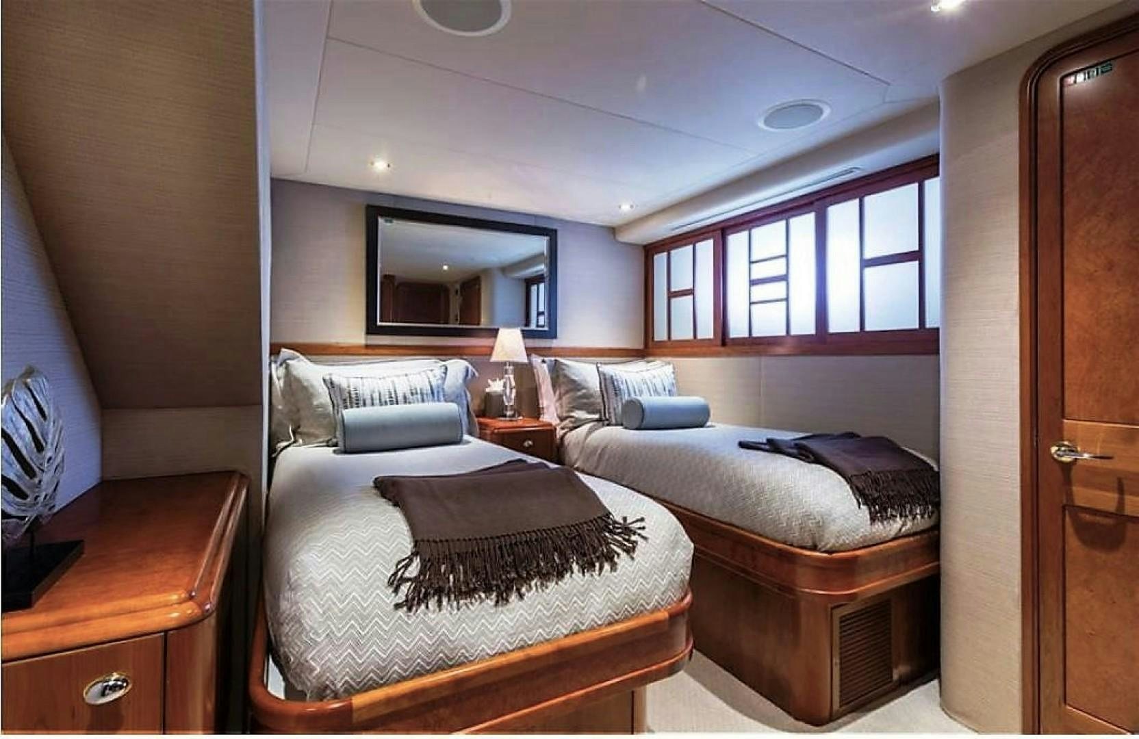 a couple of beds in a room aboard REBELLIOUS Yacht for Sale
