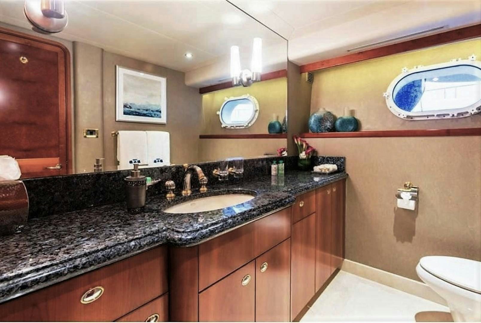 a bathroom with a marble counter top aboard REBELLIOUS Yacht for Sale