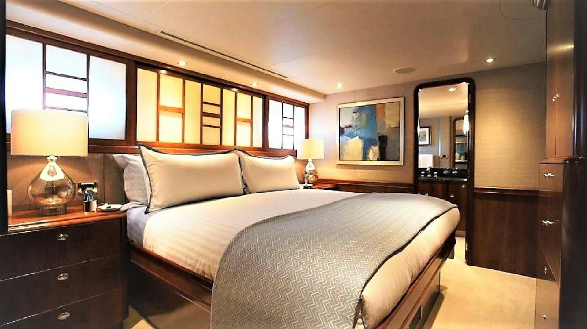 a hotel room with a bed aboard REBELLIOUS Yacht for Sale