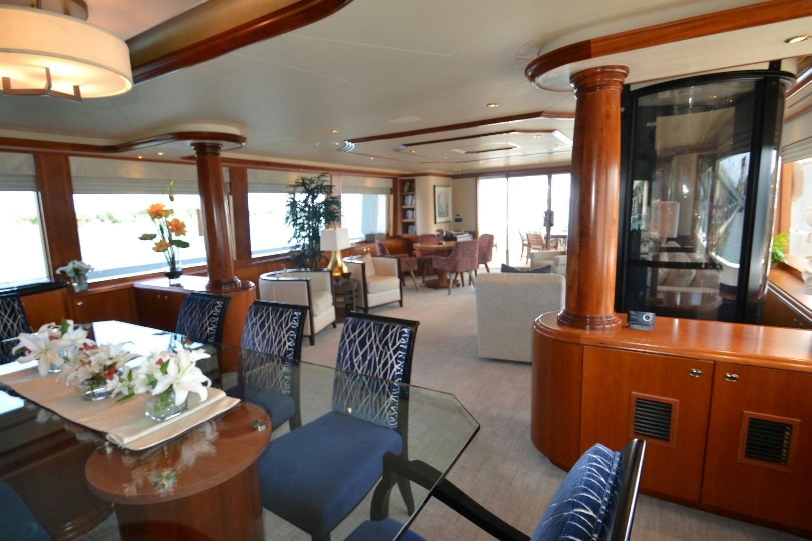 a dining room with a large mirror aboard REBELLIOUS Yacht for Sale