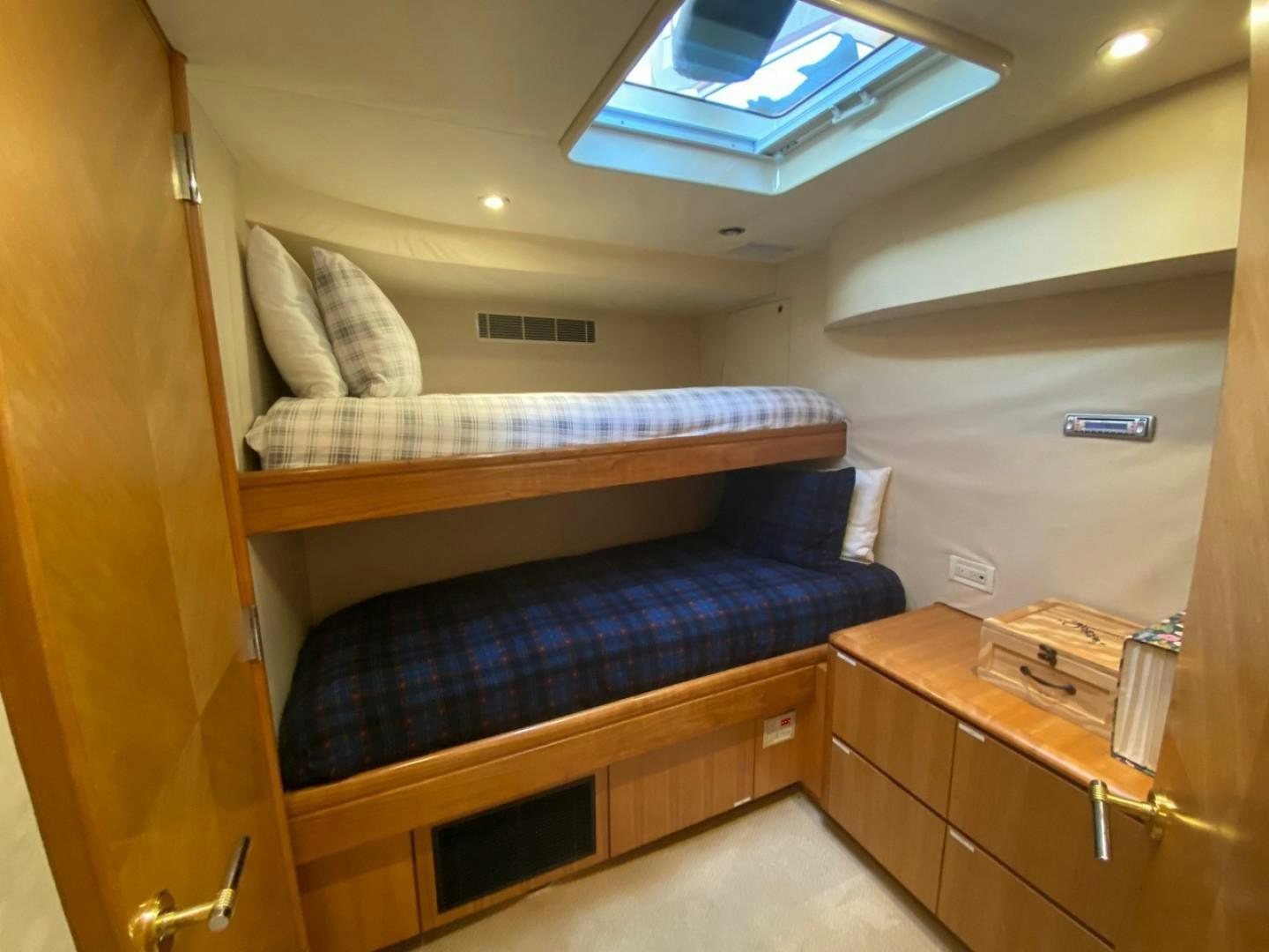 a room with bunk beds aboard EQUINOX X Yacht for Sale