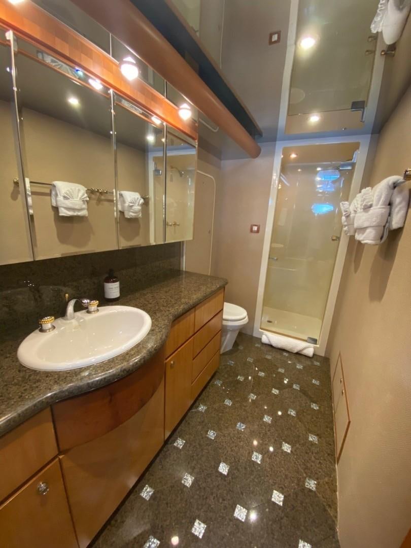 a bathroom with a large mirror aboard EQUINOX X Yacht for Sale