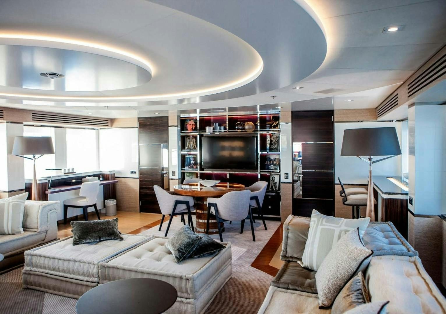 a living room with a fireplace aboard ASYA Yacht for Sale