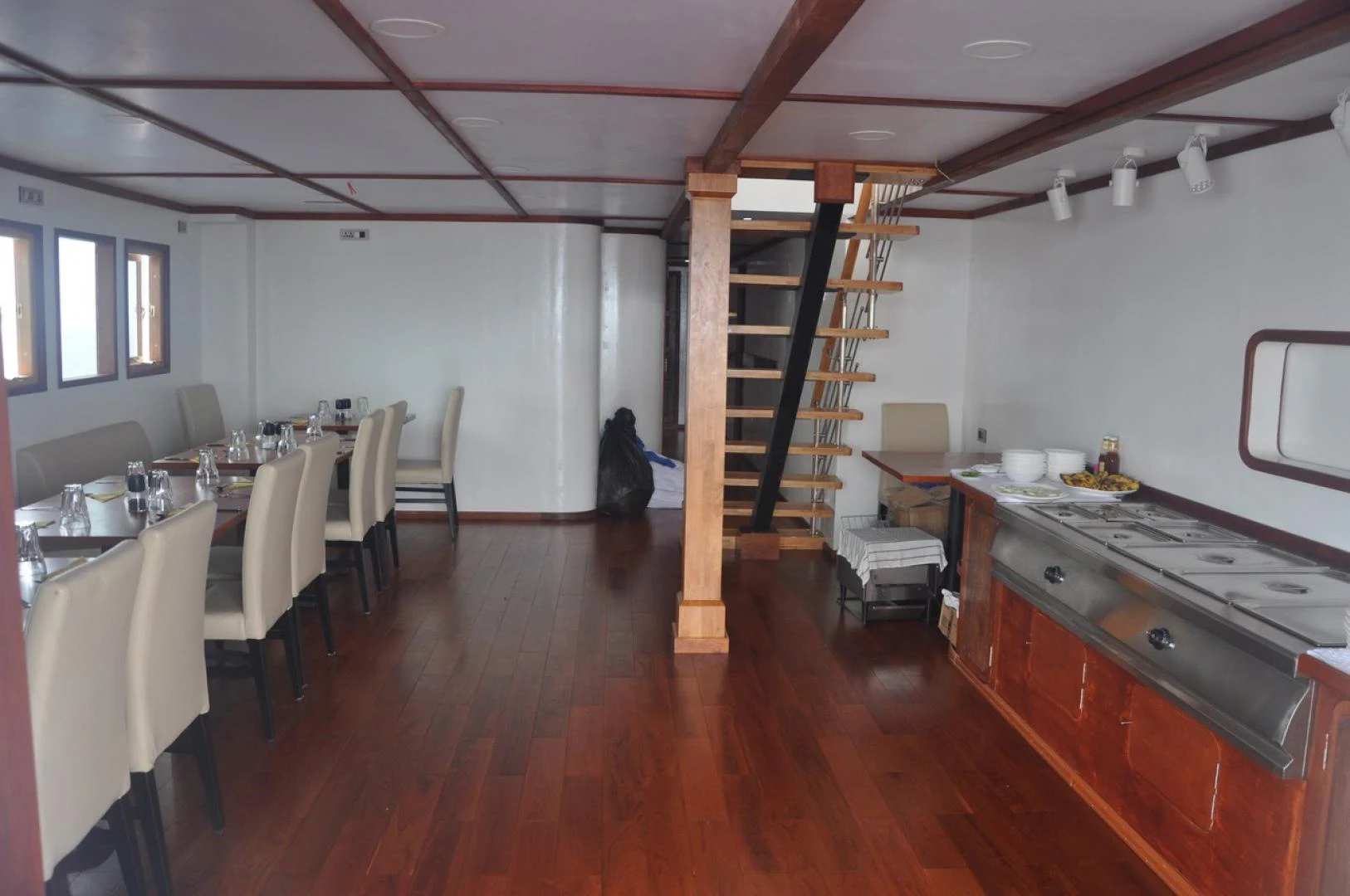 a kitchen with a ladder aboard KEANA Yacht for Sale