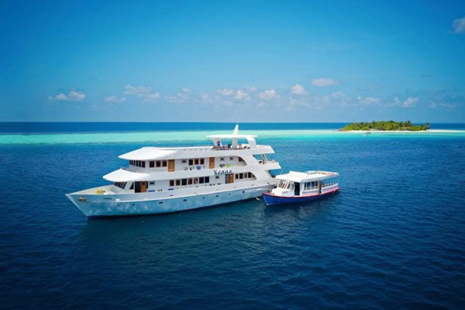 a couple of white boats in the water aboard KEANA Yacht for Sale