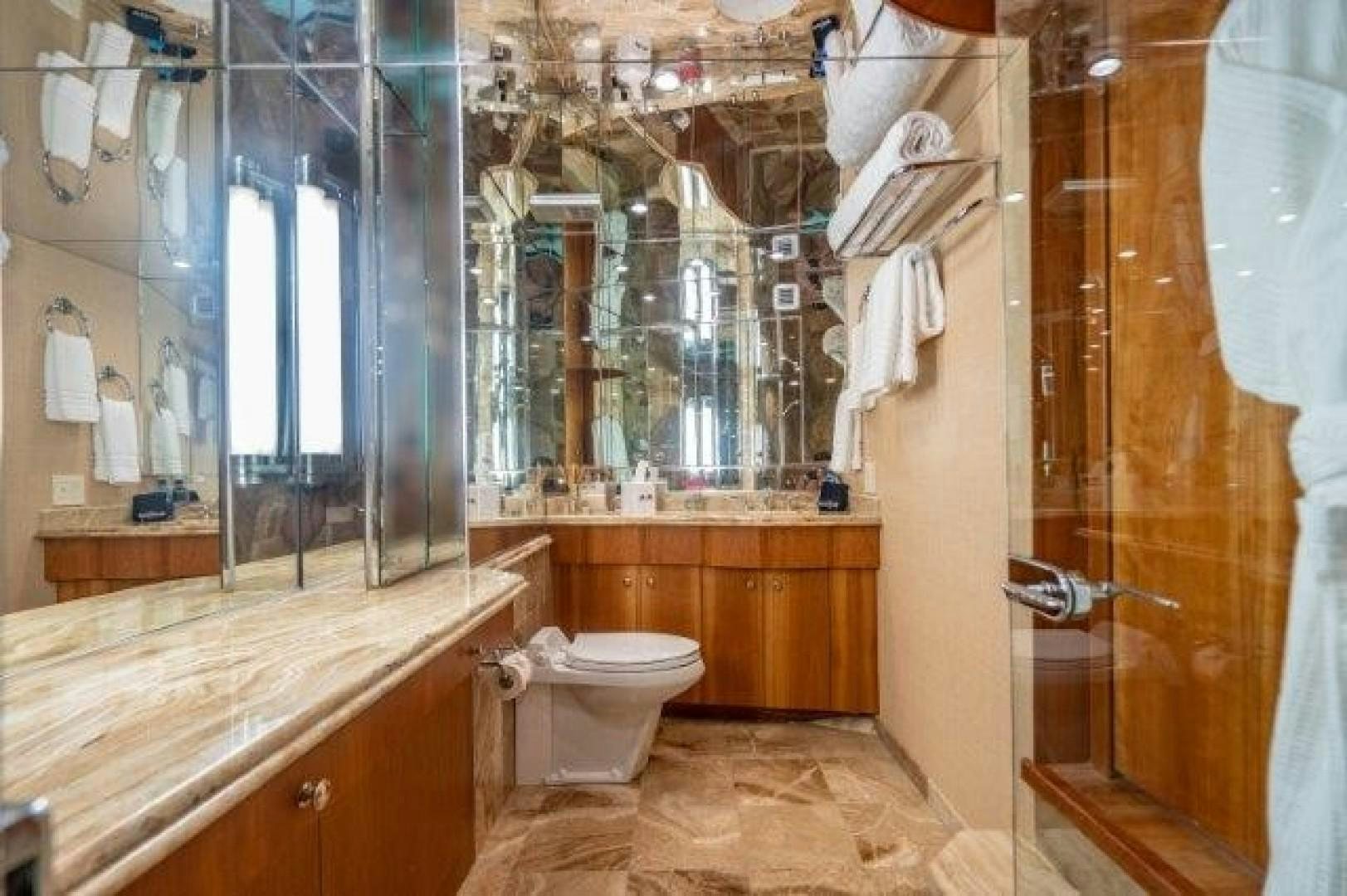 a bathroom with a toilet and a sink aboard CENTODUE Yacht for Sale