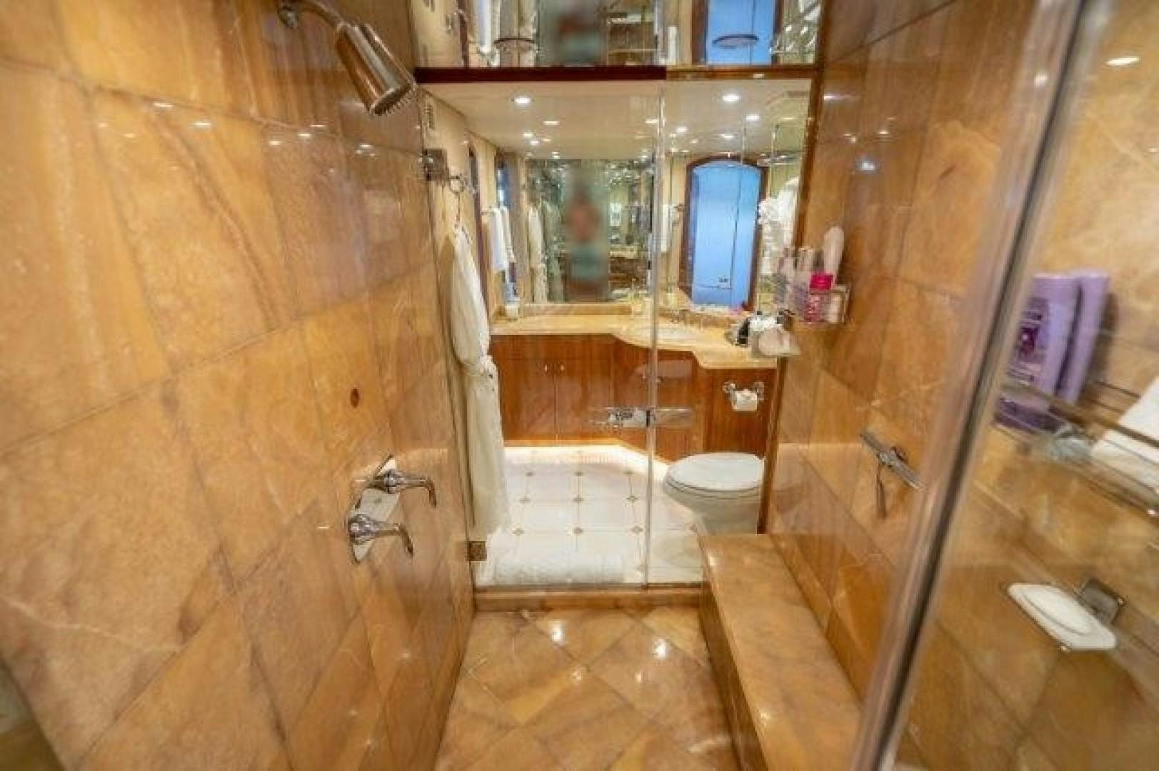 a bathroom with a toilet and a sink aboard CENTODUE Yacht for Sale