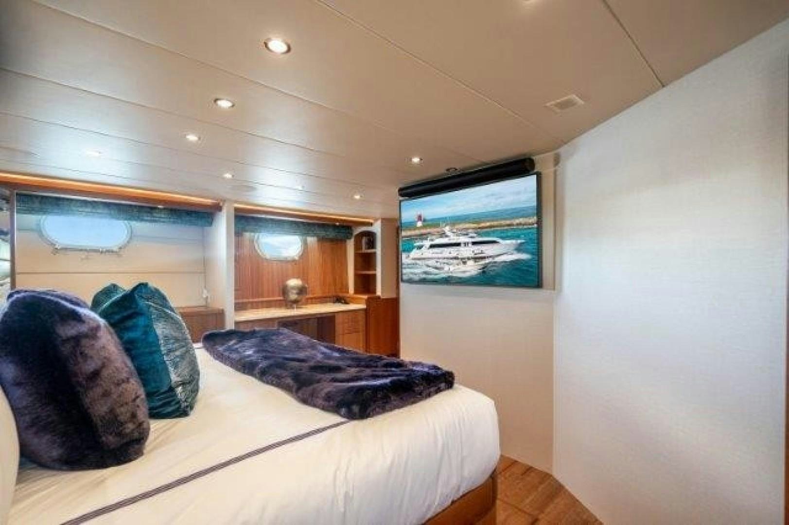 a bedroom with a large bed aboard CENTODUE Yacht for Sale