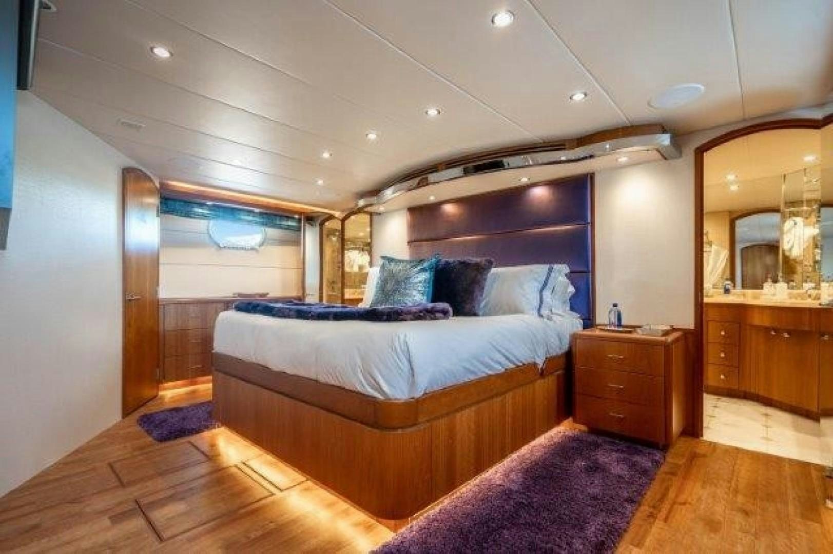 a large bedroom with a large bed aboard CENTODUE Yacht for Sale