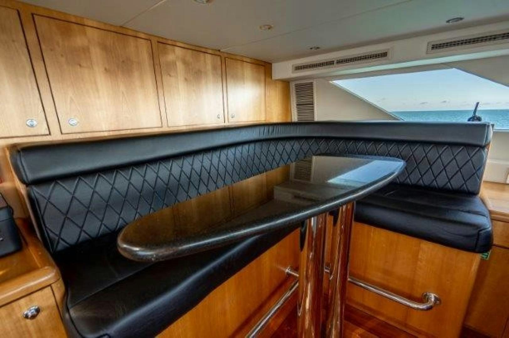 a kitchen with a large black counter aboard CENTODUE Yacht for Sale