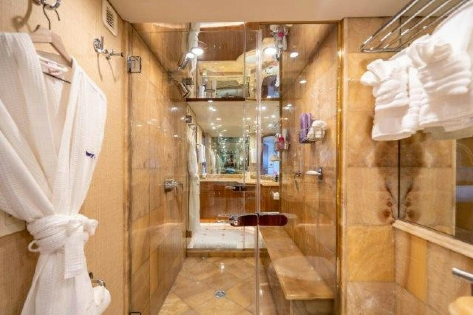 a bathroom with a shower and sink aboard CENTODUE Yacht for Sale