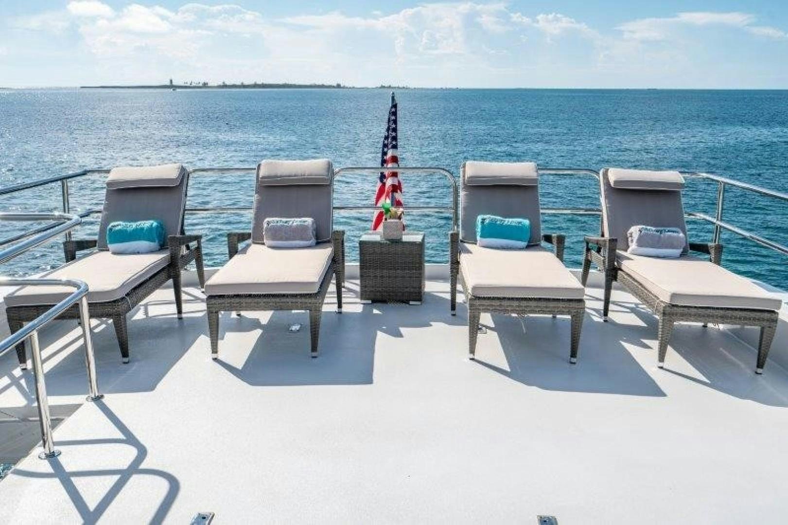 chairs on a beach aboard CENTODUE Yacht for Sale