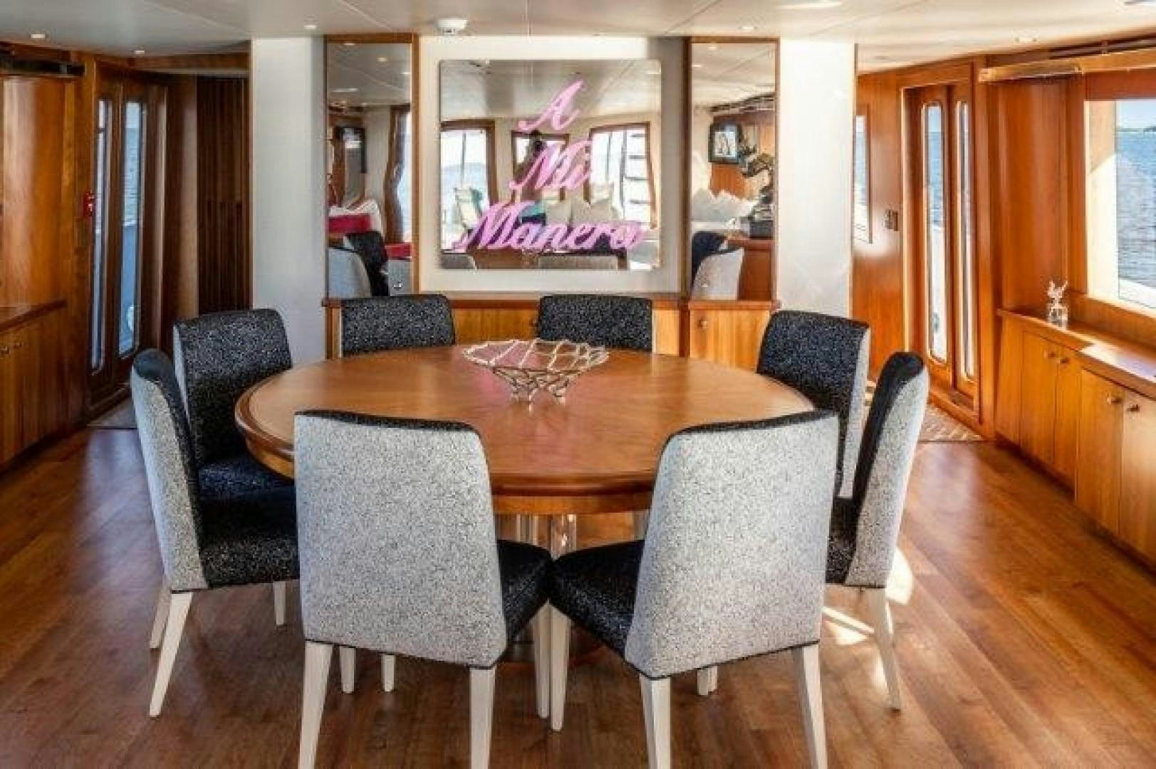 a dining table in a restaurant aboard CENTODUE Yacht for Sale