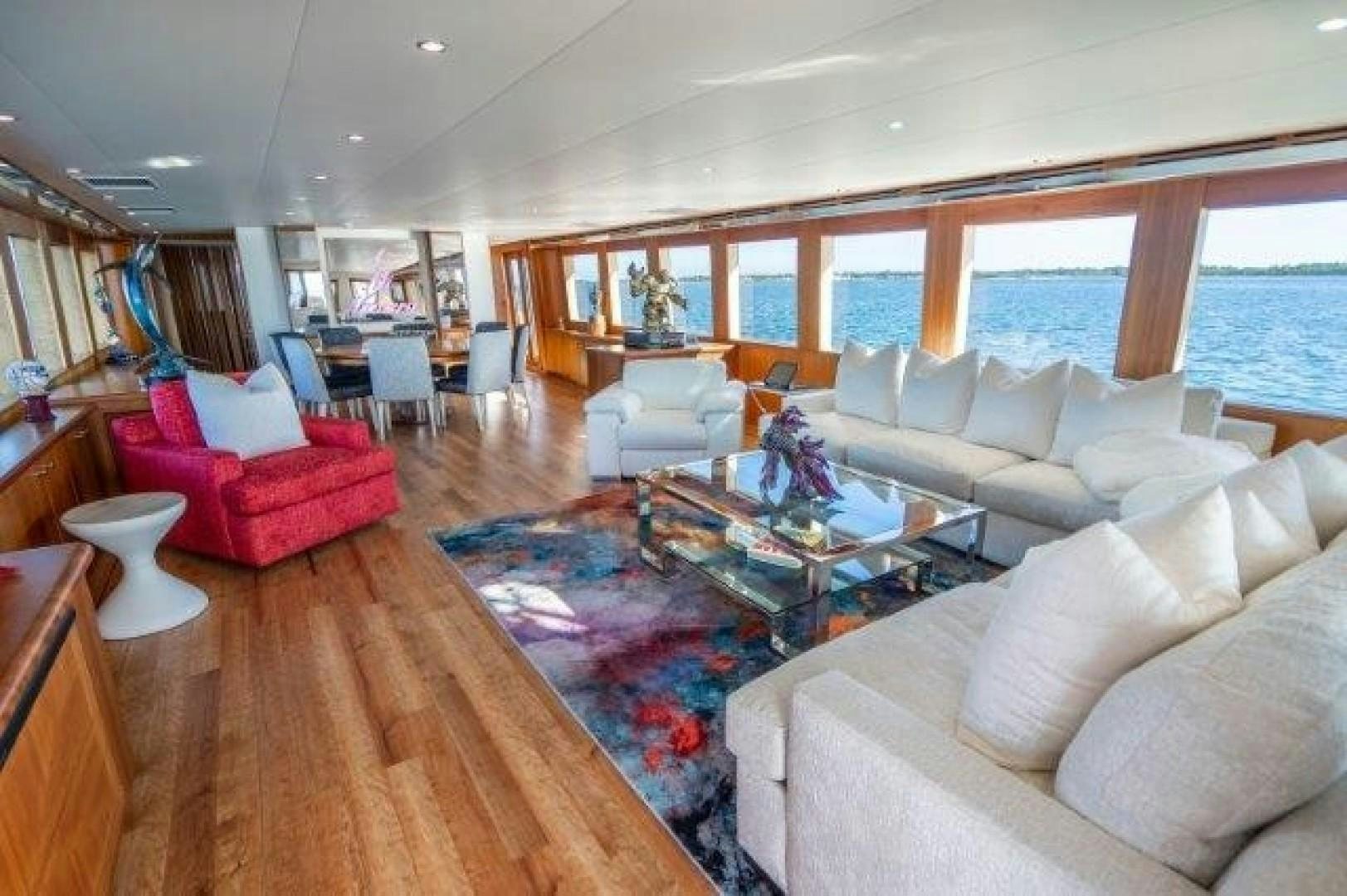 a living room with a large open window aboard CENTODUE Yacht for Sale