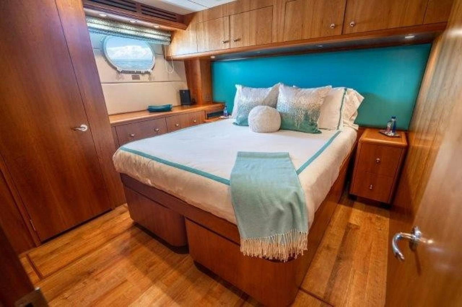 a bed in a room aboard CENTODUE Yacht for Sale
