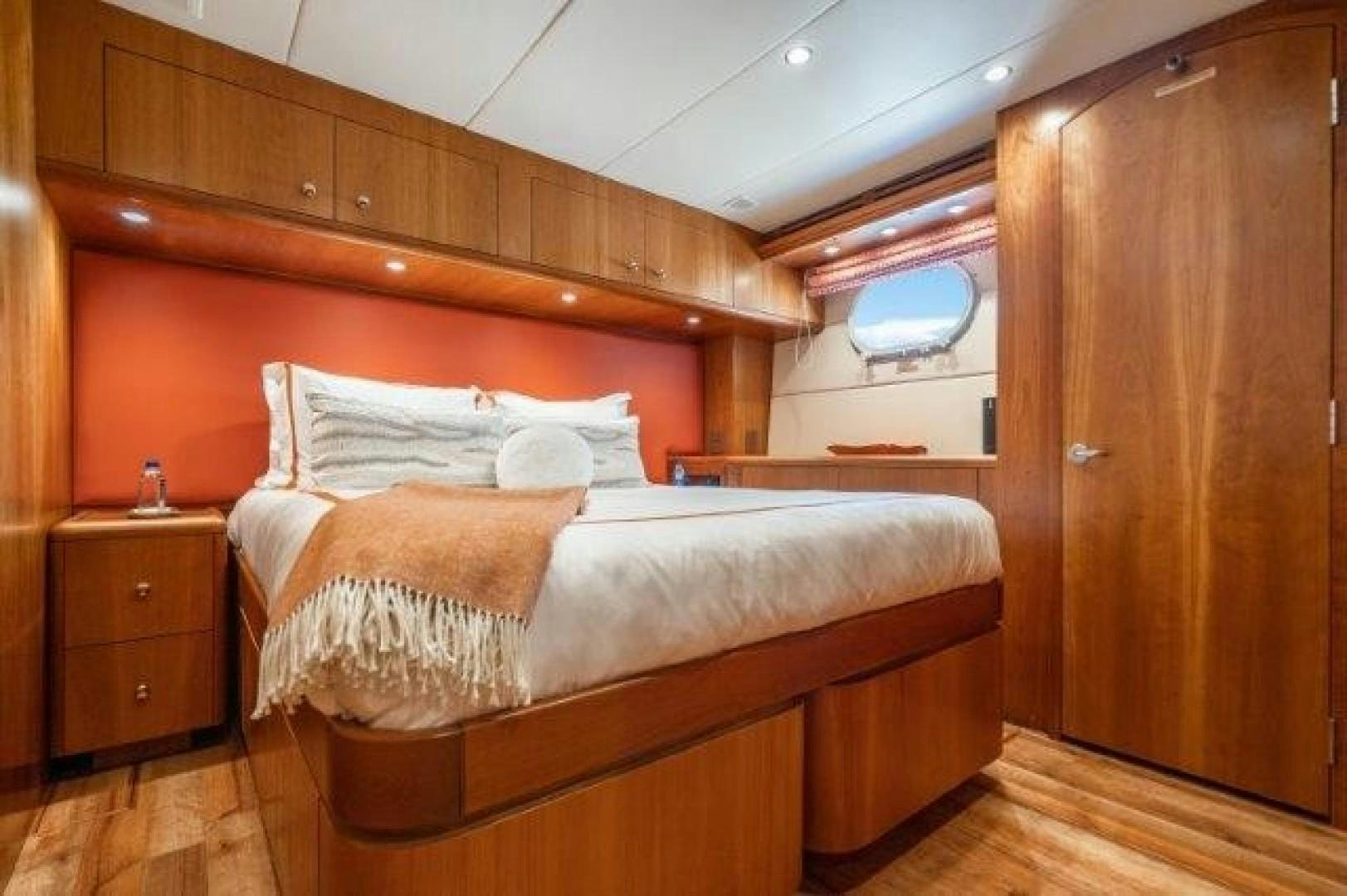 a bed in a room aboard CENTODUE Yacht for Sale