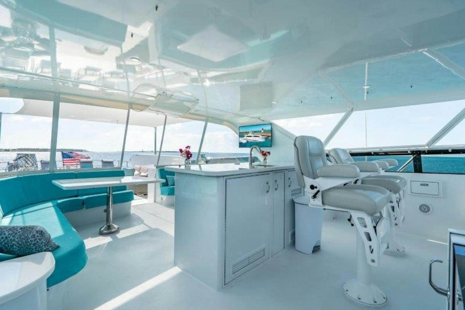 a room with a desk and chairs aboard CENTODUE Yacht for Sale