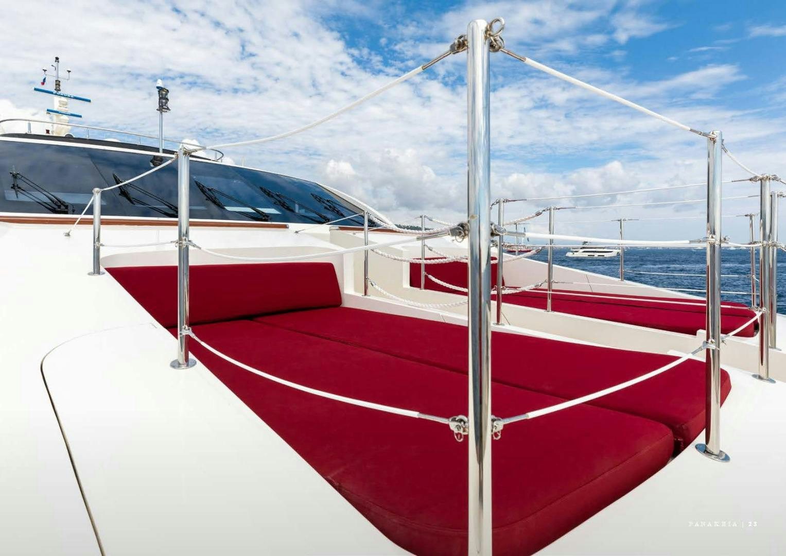 a red and white boat aboard PANAKEIA Yacht for Charter