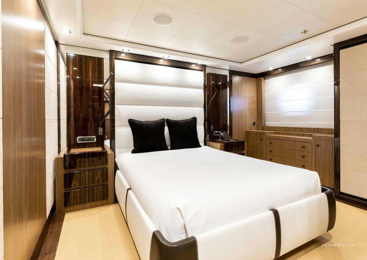 a room with a bed and a window aboard PANAKEIA Yacht for Charter
