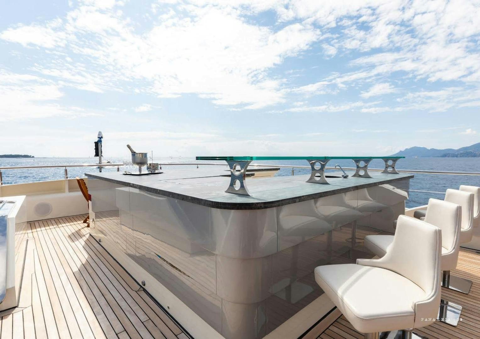 a balcony overlooking the ocean aboard PANAKEIA Yacht for Charter