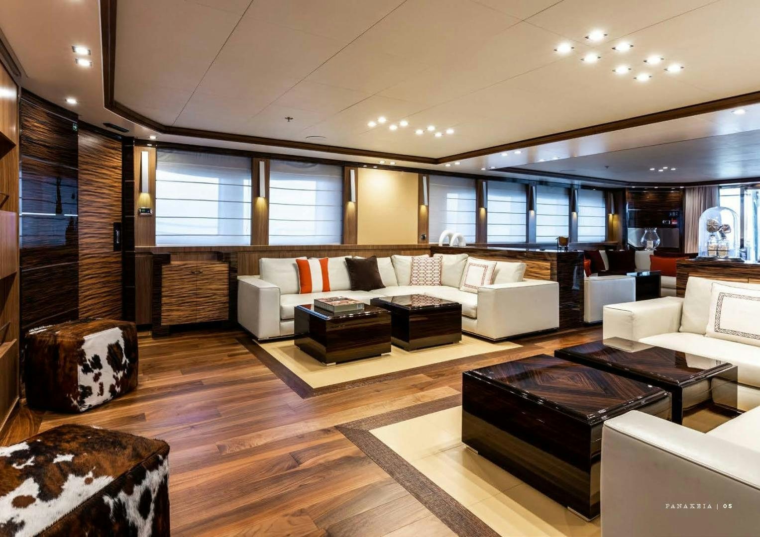 a living room with a wood floor aboard PANAKEIA Yacht for Charter