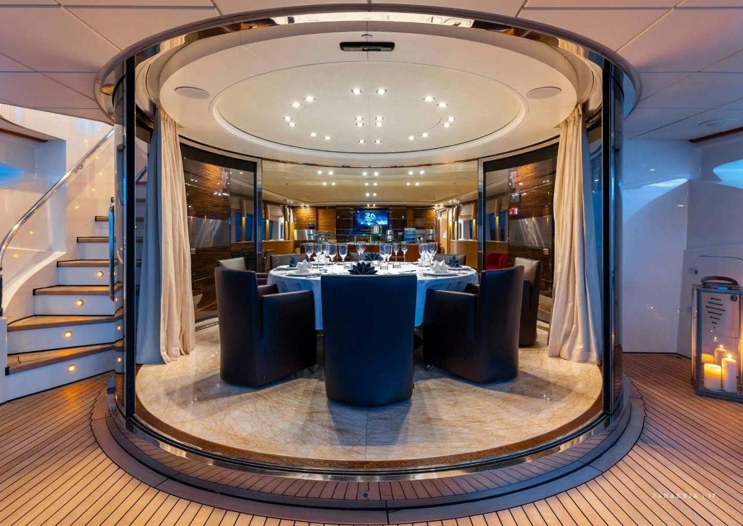 a large room with a table and chairs aboard PANAKEIA Yacht for Charter