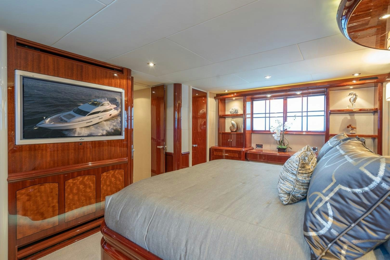 a bedroom with a bed and a mirror aboard SUMMERWIND Yacht for Sale