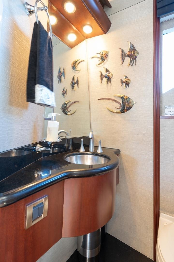 a bathroom with a sink and a mirror aboard SUMMERWIND Yacht for Sale