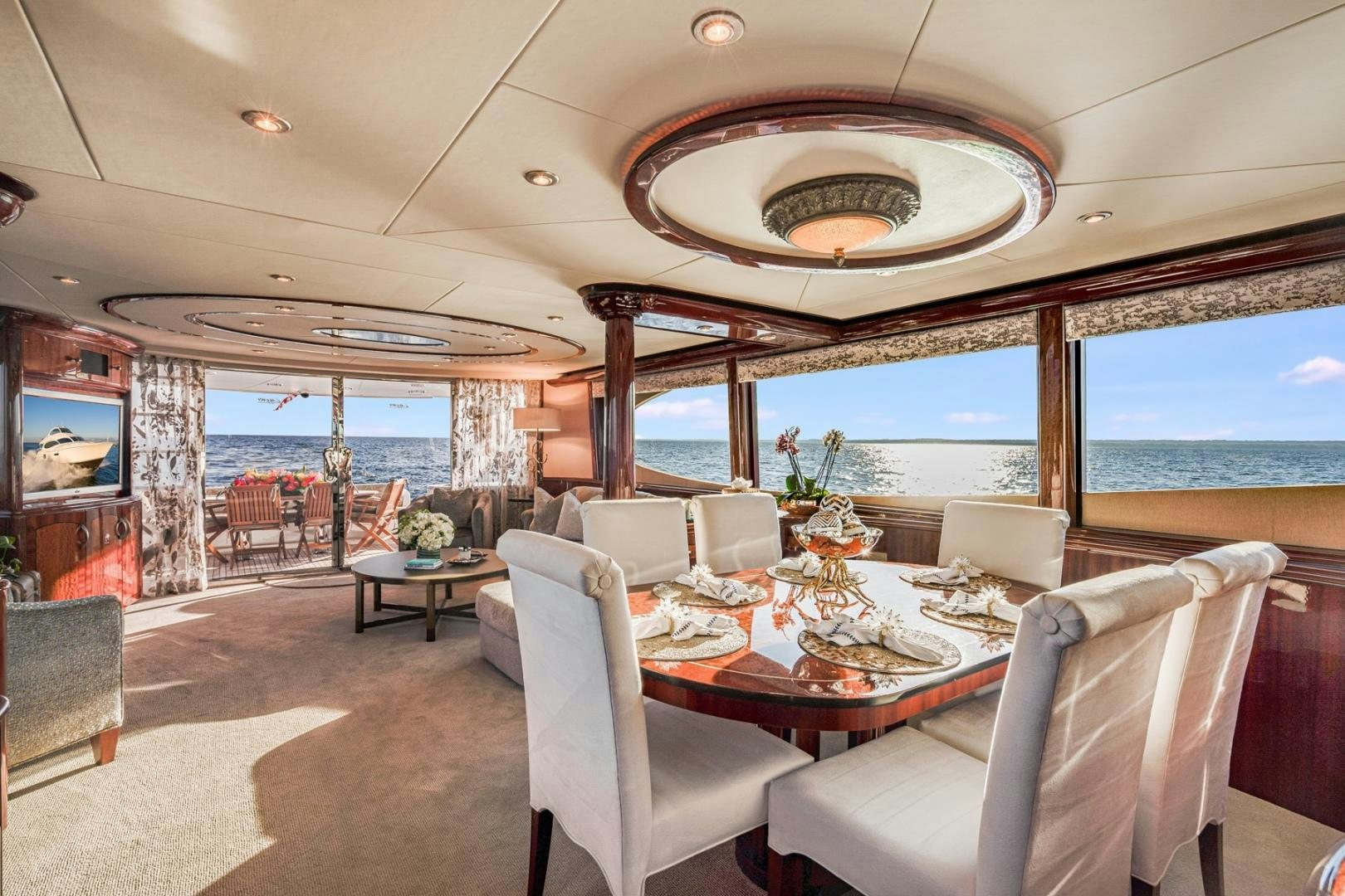 a dining room with a view of the ocean aboard SUMMERWIND Yacht for Sale