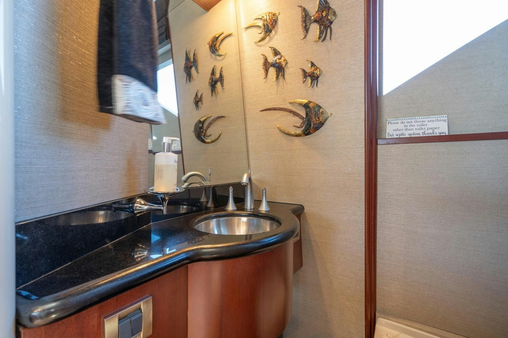 a bathroom with a sink and a mirror aboard SUMMERWIND Yacht for Sale