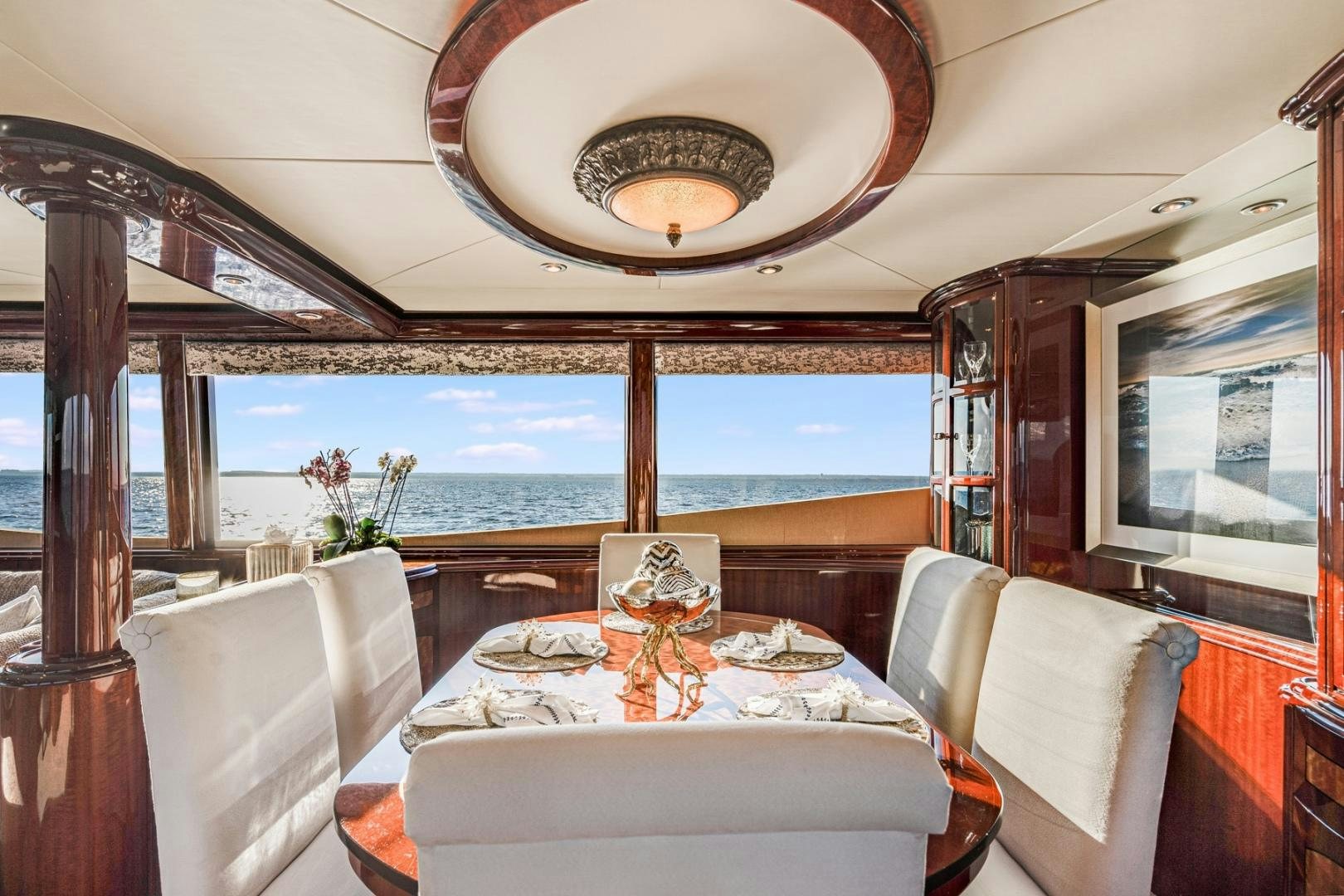 a dining room with a view of the ocean aboard SUMMERWIND Yacht for Sale