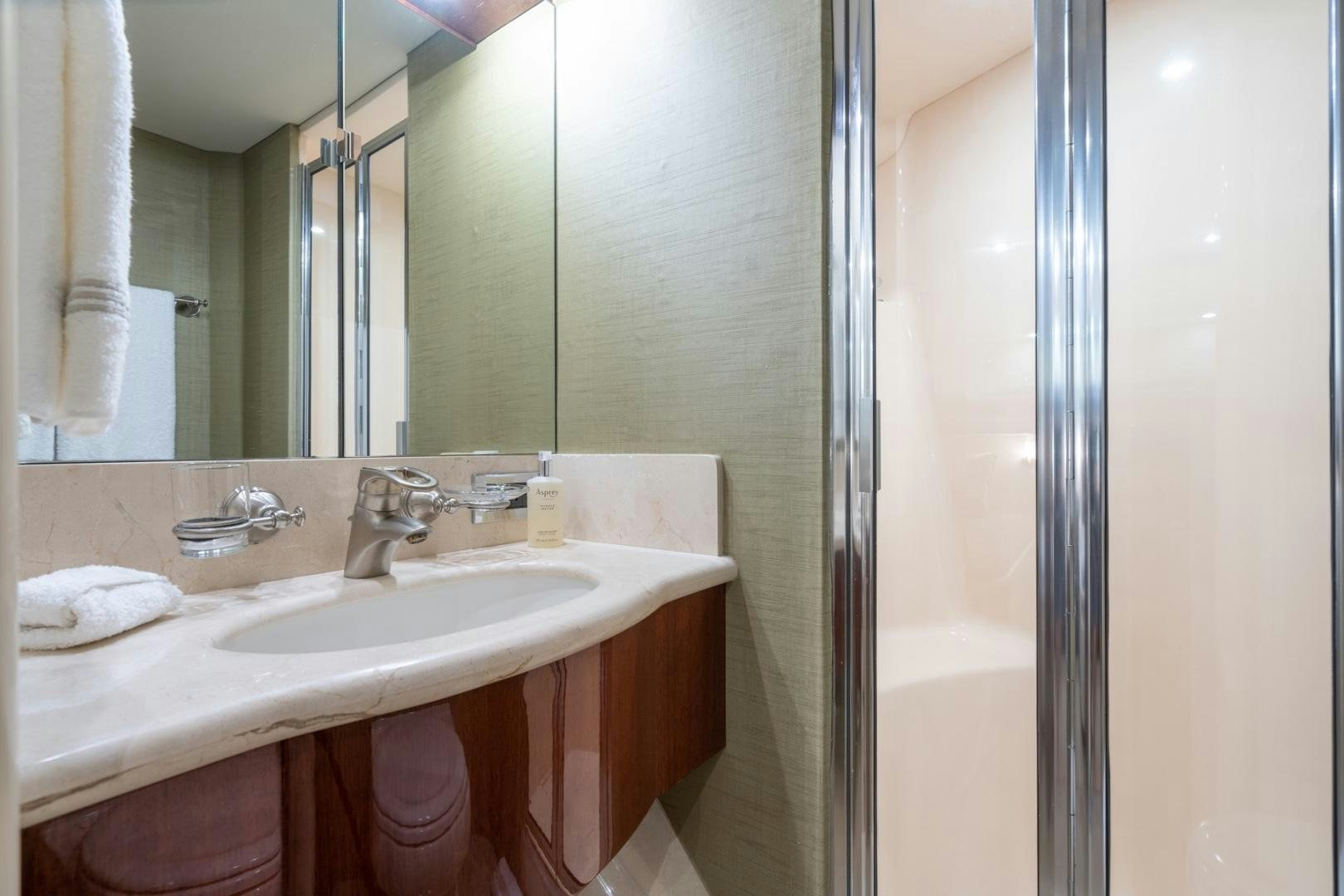 a bathroom with a sink and a shower aboard SUMMERWIND Yacht for Sale