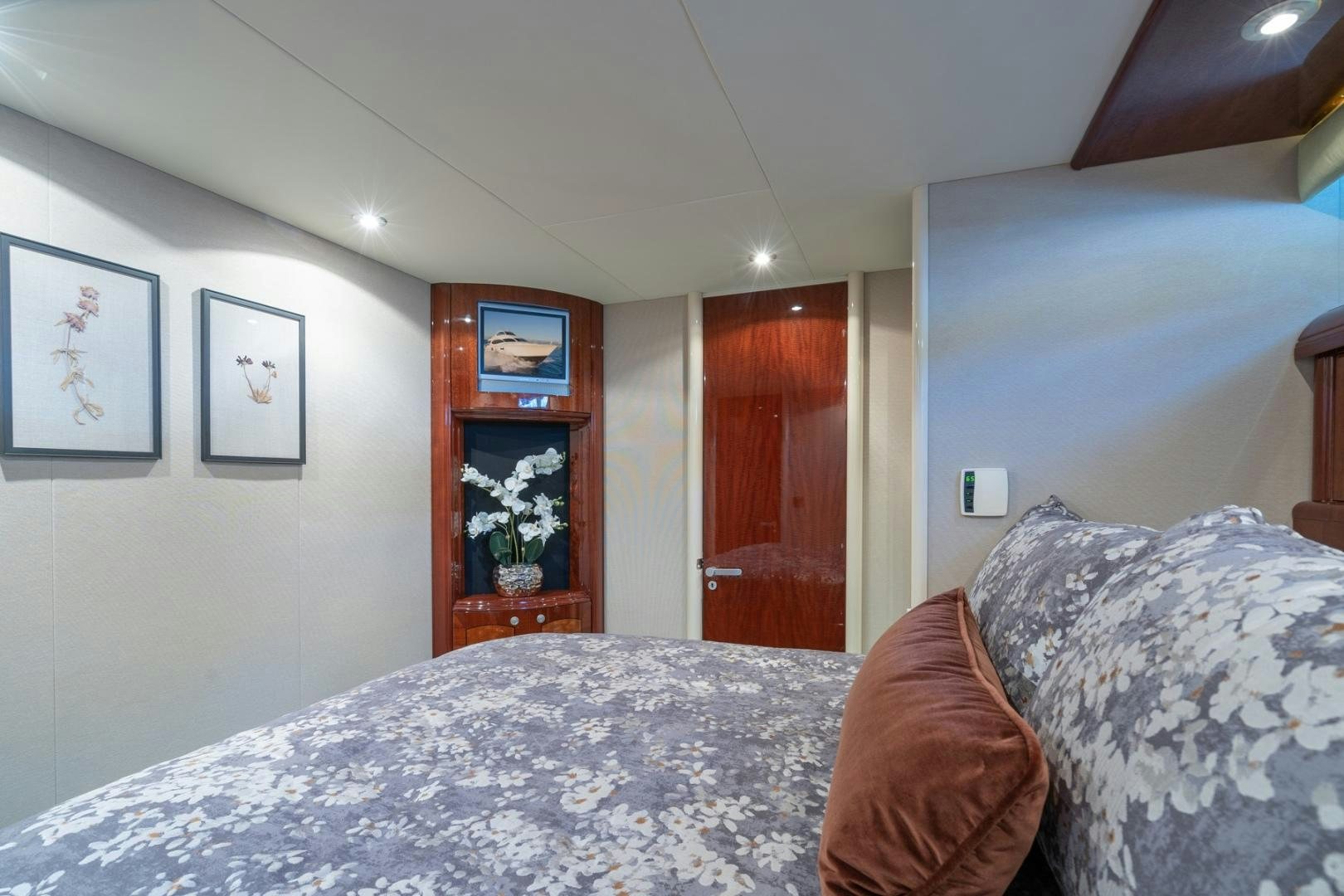 a bedroom with a bed and a mirror aboard SUMMERWIND Yacht for Sale